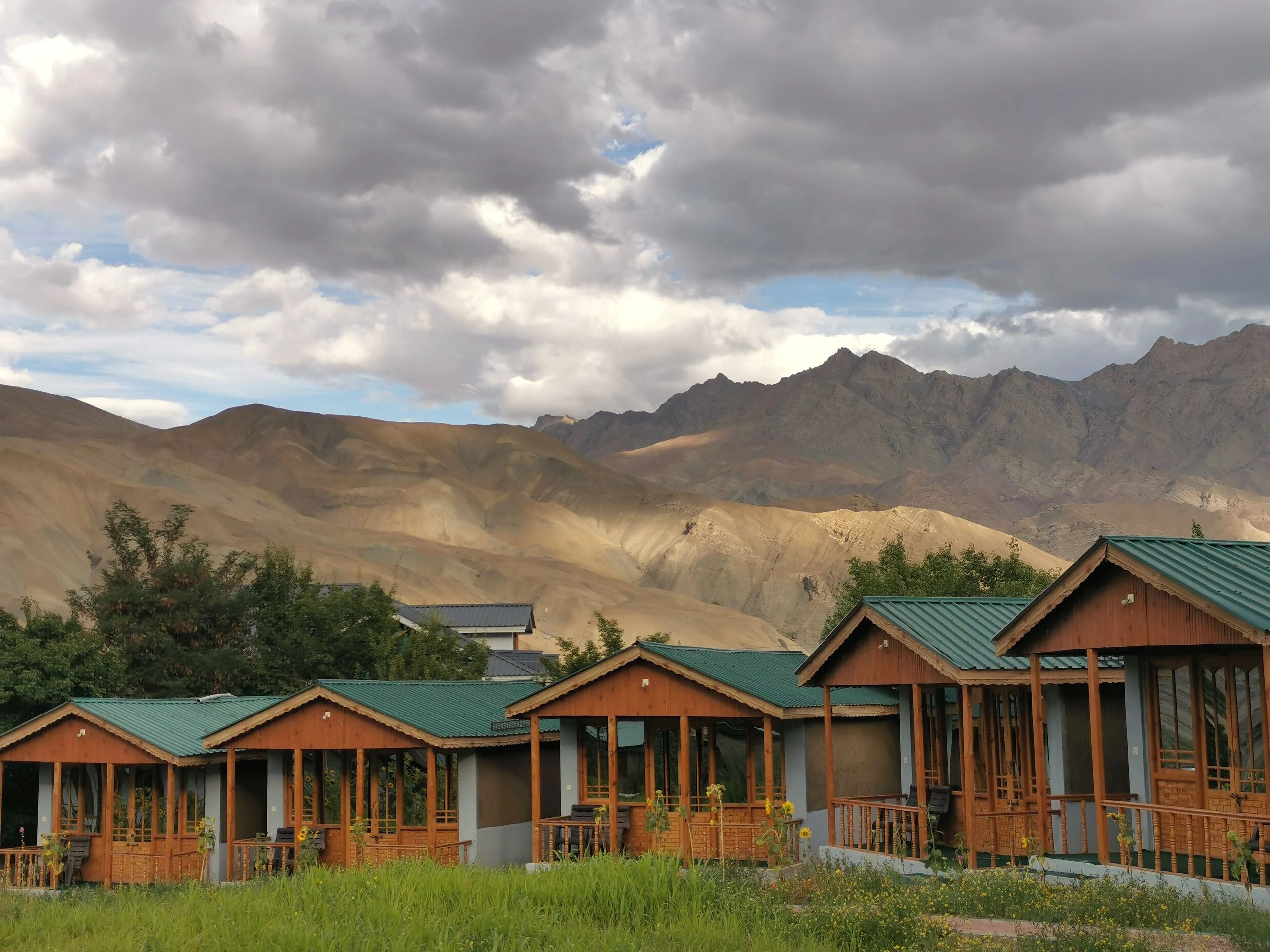 Beautiful green valley village surrounded by majestic mountains